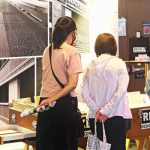 People staring at exhibits in BCI Equinox Singapore 2022